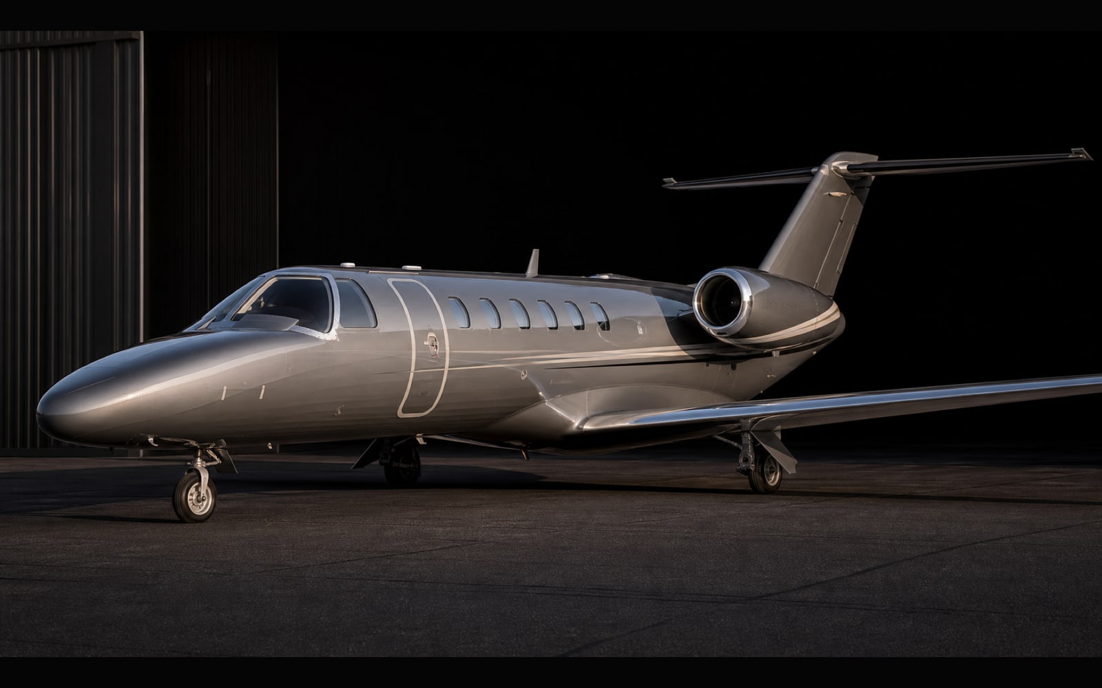 Representative Citation CJ3 light jet exterior on a dark apron